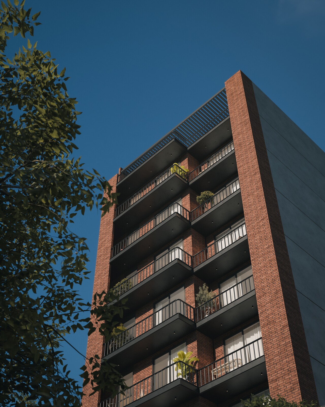 Contrapicado del edificio Canalli, ladrillo, con árbol y cable en primer plano