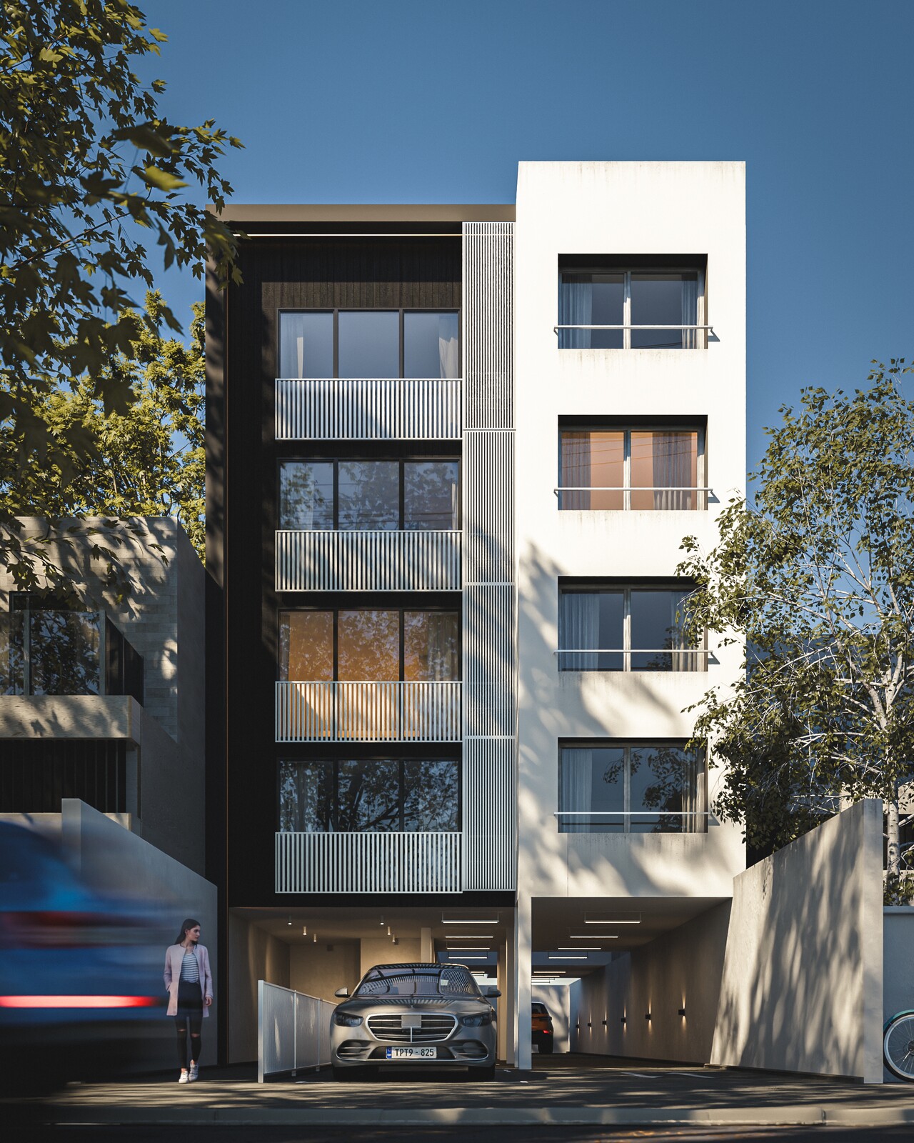 Fachada de un edificio en golden hour, con follaje en primer plano